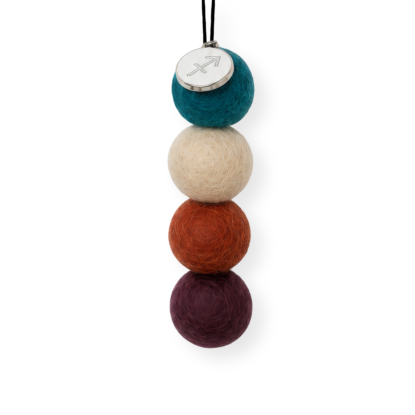 Four reusable wool felt air freshener balls in deep ocean teal blue, soft sandy beige, rust orange, and rich plum purple for the Sagittarius Zodiac Set.