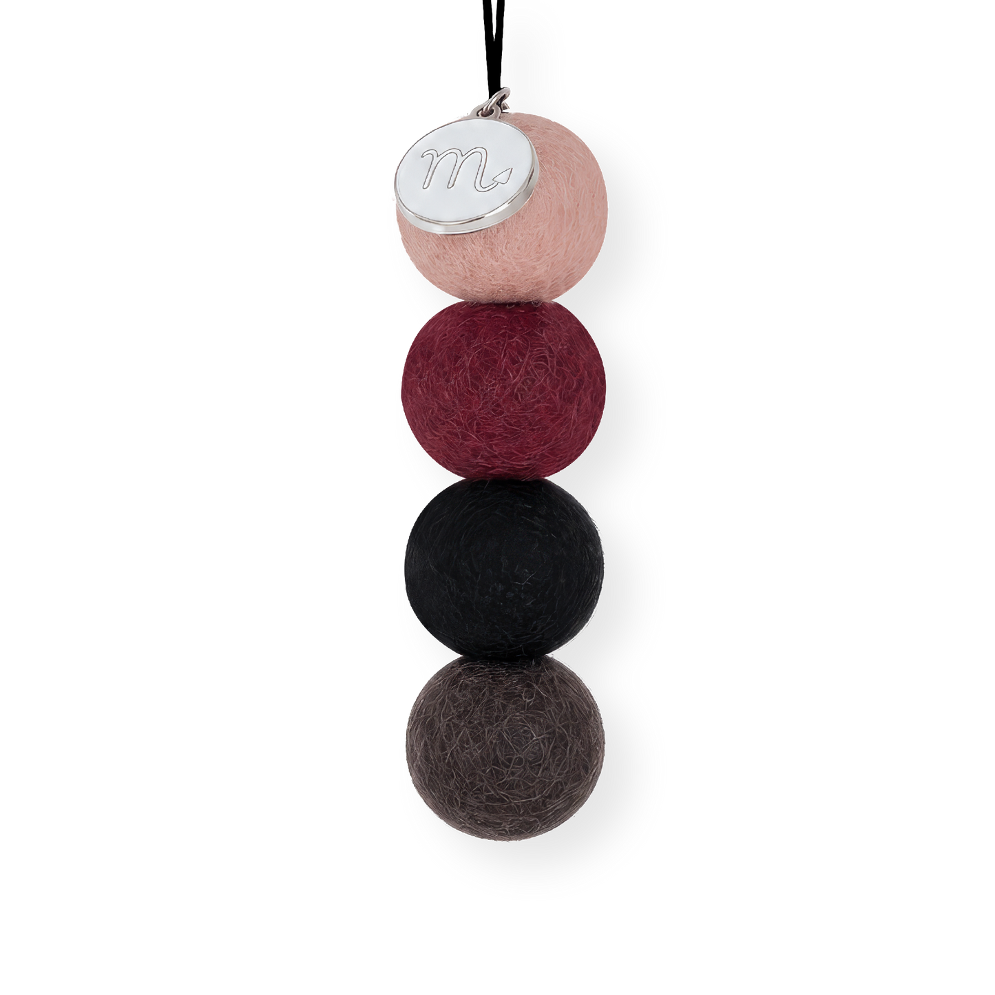 Four reusable wool felt air freshener balls in dusky blush pink, rich maroon burgundy, charcoal black, and dark slate grey for the Scorpio Zodiac Set.