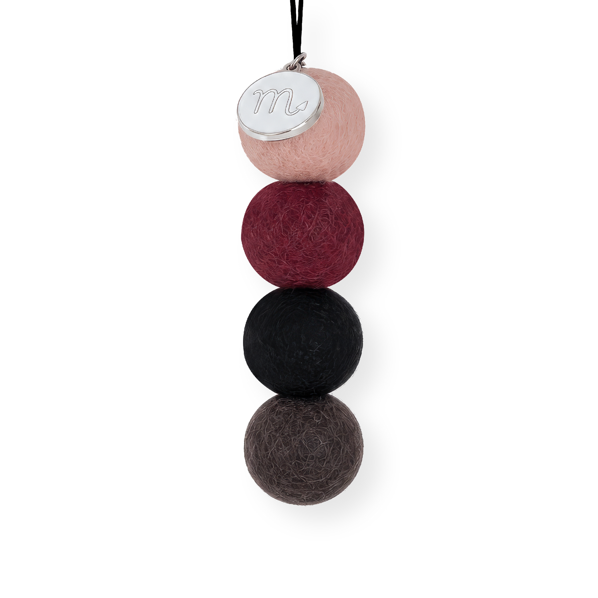 Four reusable wool felt air freshener balls in dusky blush pink, rich maroon burgundy, charcoal black, and dark slate grey for the Scorpio Zodiac Set.