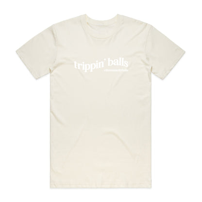 Cream t-shirt with "trippin' balls" text.